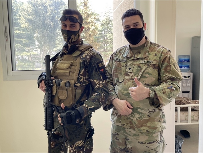 Robert Vicens in Army uniform standing beside a fellow service member
