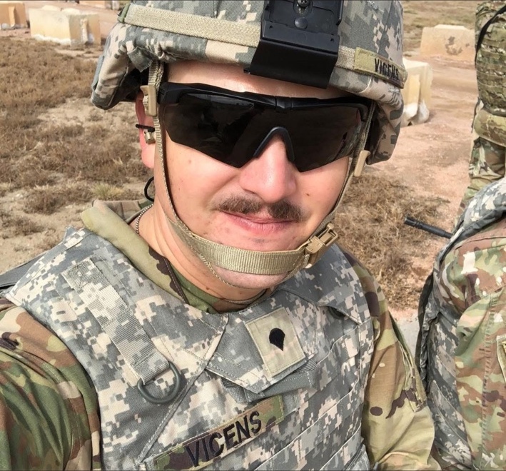 Robert Vicens wearing an Army helmet and protective glasses